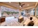 Covered patio with ample seating, fire pit, and outdoor kitchen at 101 Mirage View Dr, Henderson, NV 89011