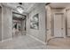 Hallway with tile floors, decorative lighting, and a view into the home's open-concept living spaces at 101 Mirage View Dr, Henderson, NV 89011