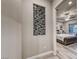 Hallway featuring a unique tile accent wall that leads into the main bedroom with a gray bed frame at 101 Mirage View Dr, Henderson, NV 89011