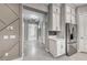 Hallway showing access to the kitchen and living spaces featuring modern lighting fixtures and decor at 101 Mirage View Dr, Henderson, NV 89011