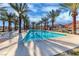 Long, inviting lap pool lined with palm trees, ideal for fitness and relaxation at 101 Mirage View Dr, Henderson, NV 89011