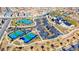 Aerial view of community tennis and pickleball courts, complemented by lush landscaping and modern facilities at 101 Mirage View Dr, Henderson, NV 89011
