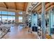 Spacious weight room boasting state-of-the-art equipment and floor-to-ceiling windows with mountain views at 101 Mirage View Dr, Henderson, NV 89011