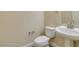 Powder room featuring modern fixtures, pedestal sink, and sleek toilet at 10311 Birch Bluff Ln, Las Vegas, NV 89145