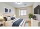 Cozy bedroom with a comfortable bed, stylish decor, and ample natural light at 10311 Birch Bluff Ln, Las Vegas, NV 89145