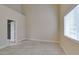 Vacant bedroom with tile floors, ensuite access, vaulted ceilings, and lots of natural light at 10311 Birch Bluff Ln, Las Vegas, NV 89145