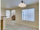 Dining area with a view to the staircase and living room at 10311 Birch Bluff Ln, Las Vegas, NV 89145