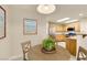 Bright dining area with a view to the kitchen at 10311 Birch Bluff Ln, Las Vegas, NV 89145