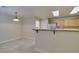 Bright kitchen features stainless steel appliances, light wood cabinets, and a breakfast bar at 10311 Birch Bluff Ln, Las Vegas, NV 89145