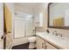 Bathroom featuring shower over tub, a modern vanity with a marble countertop, and modern fixtures at 10476 Tyler Park Ave, Las Vegas, NV 89135