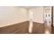 Bedroom with dark wood floors, neutral color scheme, and an en-suite bathroom with a glass-enclosed shower at 10476 Tyler Park Ave, Las Vegas, NV 89135
