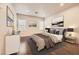 Cozy bedroom featuring a stylish bed, modern decor, and ample natural light at 10476 Tyler Park Ave, Las Vegas, NV 89135