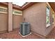 Side view of a home with an air conditioning unit at 10476 Tyler Park Ave, Las Vegas, NV 89135