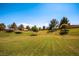 Scenic green space with mature trees and lush lawns offers a serene neighborhood atmosphere at 10476 Tyler Park Ave, Las Vegas, NV 89135