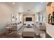 Elegant living room featuring neutral tones, hardwood floors, and recessed lighting at 10476 Tyler Park Ave, Las Vegas, NV 89135