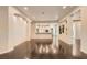 Spacious living room with hardwood floors, recessed lighting, and a view to the kitchen at 10476 Tyler Park Ave, Las Vegas, NV 89135