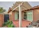 Charming covered patio with outdoor seating, perfect for enjoying the fresh air and serene surroundings at 10476 Tyler Park Ave, Las Vegas, NV 89135