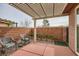 Cozy covered patio with lounge seating, a pergola, and a brick privacy wall at 10476 Tyler Park Ave, Las Vegas, NV 89135