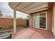Inviting covered patio featuring a sliding glass door, ideal for seamless indoor-outdoor living at 10476 Tyler Park Ave, Las Vegas, NV 89135