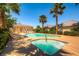 Inviting community pool and spa area with ample seating surrounded by palm trees and shade at 10476 Tyler Park Ave, Las Vegas, NV 89135