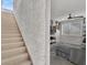 Staircase leading to a upstairs living area with a gray sectional and airplane decor at 10608 Kennedy Peak Ln, Las Vegas, NV 89166