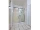 Bathroom featuring a glass-enclosed shower with white tiles, providing a clean and modern space at 1080 Laguna Park Ct, Las Vegas, NV 89110