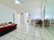 Spacious bedroom with tile flooring, ceiling fan, and desk workspace at 1080 Laguna Park Ct, Las Vegas, NV 89110