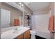 Bathroom with a single sink vanity and a shower-tub combination at 11092 Abbeyfield Rose Dr, Henderson, NV 89052