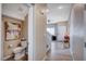Powder room with decorative art and wood-look tile flooring at 11092 Abbeyfield Rose Dr, Henderson, NV 89052