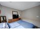 Bedroom showcasing a wood dresser with a TV and decorative mirror at 11092 Abbeyfield Rose Dr, Henderson, NV 89052