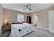 Bedroom with a ceiling fan, bird-themed bedding, and natural light from the window at 11092 Abbeyfield Rose Dr, Henderson, NV 89052