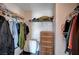 Walk-in closet provides ample storage with wire shelving, clothing racks, and wicker drawers at 11092 Abbeyfield Rose Dr, Henderson, NV 89052