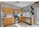 Modern kitchen featuring stainless steel appliances, bright countertops, and a functional layout for an efficient cooking experience at 11092 Abbeyfield Rose Dr, Henderson, NV 89052