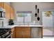 Bright kitchen with stainless steel appliances, a window with an outside view, and stylish decor, enhancing its visual appeal at 11092 Abbeyfield Rose Dr, Henderson, NV 89052