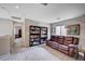 Spacious loft area with comfortable seating and built-in bookshelves at 11092 Abbeyfield Rose Dr, Henderson, NV 89052
