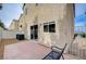 Cozy patio with stone and tile, featuring a small fenced-in yard that offers a private outdoor living space at 11092 Abbeyfield Rose Dr, Henderson, NV 89052