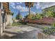 Paver patio in backyard featuring mature landscaping and palm trees, perfect for outdoor living at 11221 Stanwick Ave, Las Vegas, NV 89138