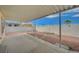 Wide shot of the backyard patio featuring desert landscaping and block wall at 1292 Dalene Ave, Henderson, NV 89002