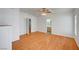 Inviting bedroom offering hardwood floors, a ceiling fan, and an adjacent bathroom at 1292 Dalene Ave, Henderson, NV 89002