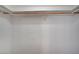 Walk-in closet offers ample hanging space with a wood pole for organized storage at 1292 Dalene Ave, Henderson, NV 89002