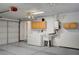 Bright garage featuring laundry hookups, a utility sink, storage cabinets, and ample open space at 1292 Dalene Ave, Henderson, NV 89002