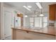 Cozy kitchen featuring a breakfast bar, modern appliances, and warm natural light at 1292 Dalene Ave, Henderson, NV 89002