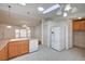 Bright kitchen features light wood cabinets, white appliances, and access to a dining area at 1292 Dalene Ave, Henderson, NV 89002