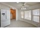 Sunny eat-in kitchen with white appliances, tile flooring, and large windows overlooking the patio at 1292 Dalene Ave, Henderson, NV 89002