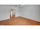 Spacious living room with hardwood floors, ceiling fan, and access to the kitchen at 1292 Dalene Ave, Henderson, NV 89002