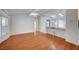Bright living room with hardwood floors, fan and views into other areas of the house at 1292 Dalene Ave, Henderson, NV 89002