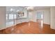 Open-concept living space with hardwood floors, leading into a kitchen and additional rooms at 1292 Dalene Ave, Henderson, NV 89002