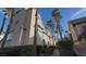 Lovely multi-story home with desert landscaping and palm trees under a beautiful blue sky at 1505 Couples St, Las Vegas, NV 89128