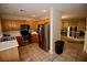 Well-equipped kitchen with stainless steel appliances, wooden cabinets, and tile flooring at 1505 Couples St, Las Vegas, NV 89128