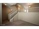 Bright living room features an open staircase with white railings at 1505 Couples St, Las Vegas, NV 89128